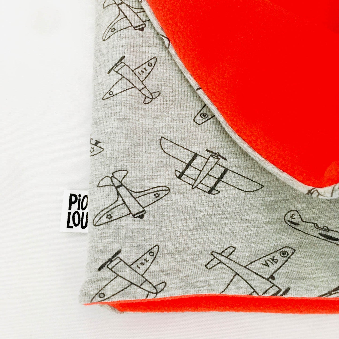 Tour de cou enfant réversible rouge et gris motifs avion
