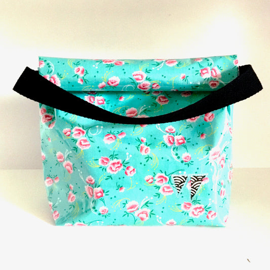 Lunch bag enduit bleu à motifs roses