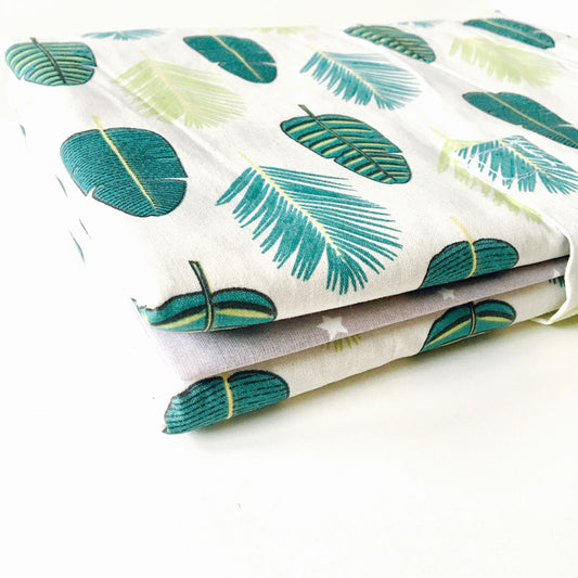 Tapis à langer nomade gris feuilles