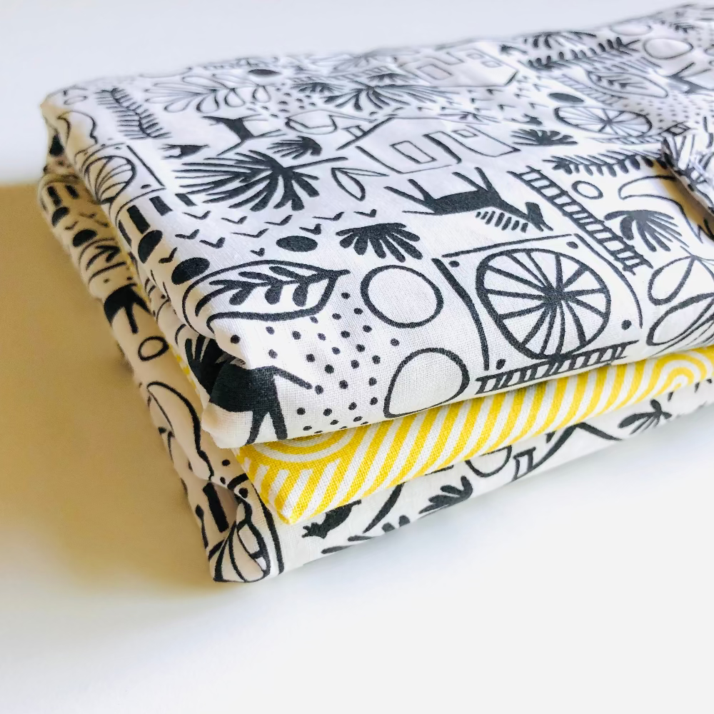 tapis a langer nomade jaune noir et blanc