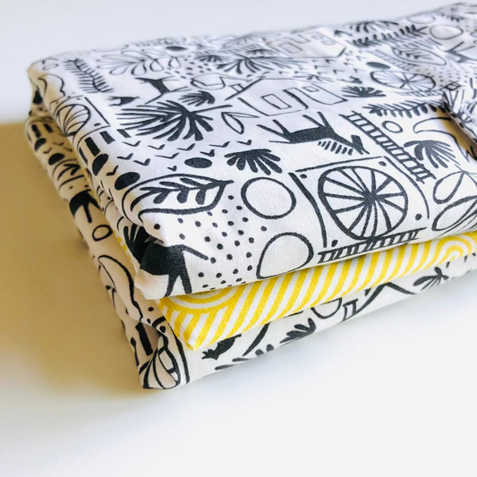 tapis a langer nomade jaune noir et blanc