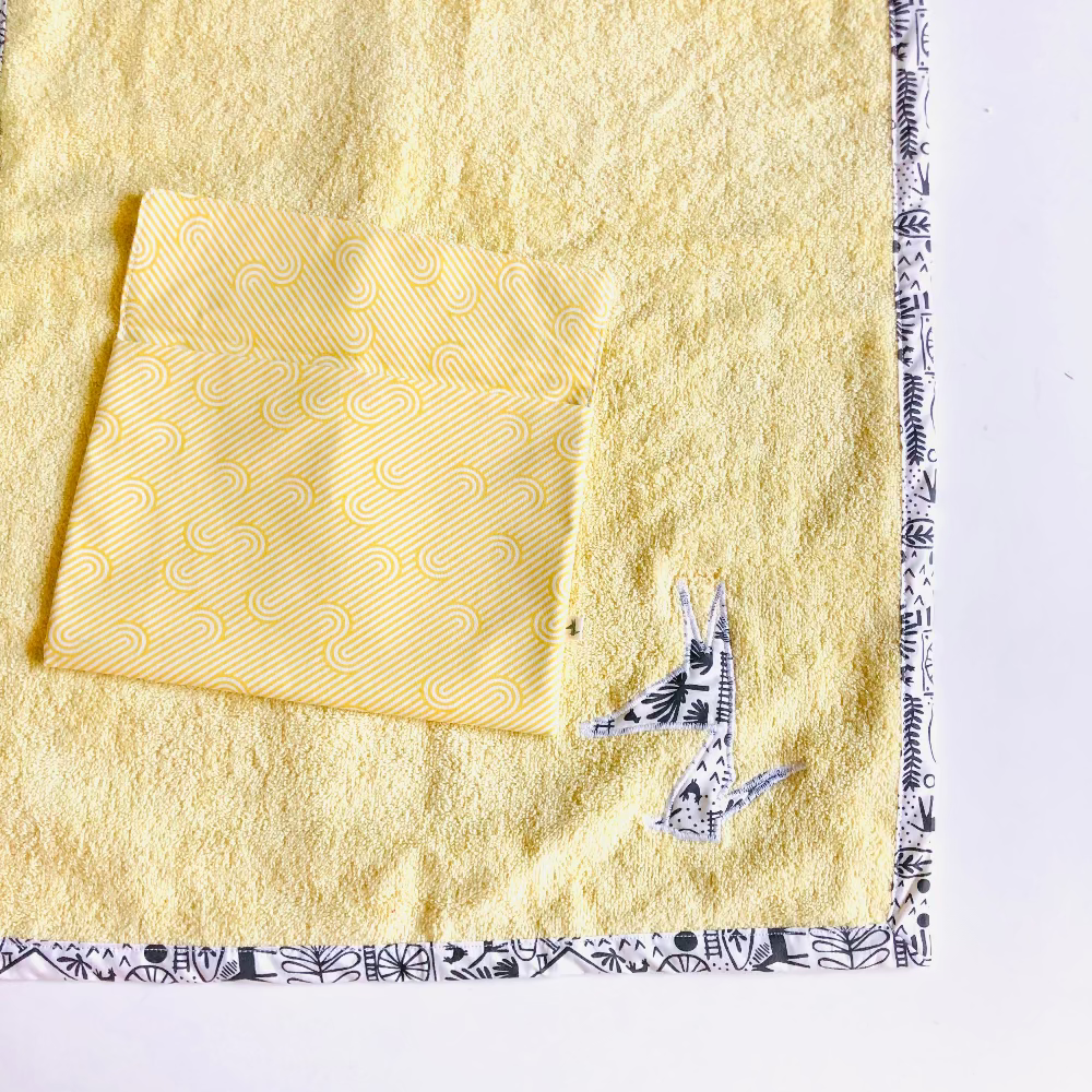 tapis a langer nomade jaune noir et blanc