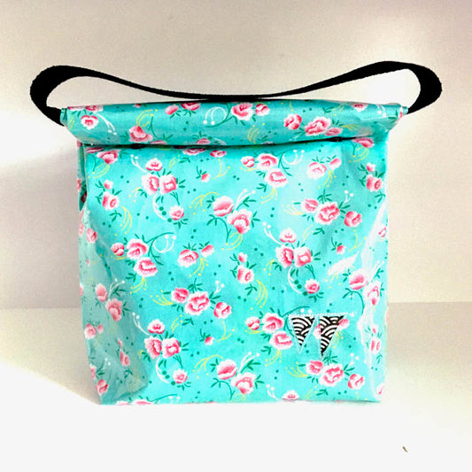 Lunch bag enduit bleu à motifs roses